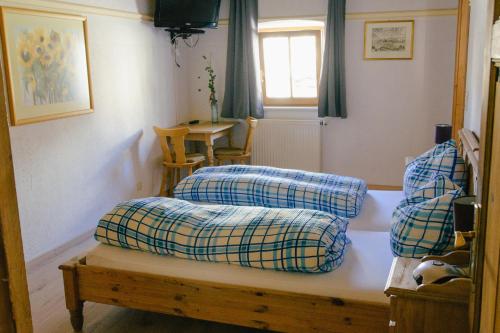 a living room with two pillows on a table at Pension Lex in Bad Reichenhall