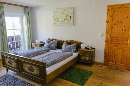 a bedroom with two beds and a window at Pension Lex in Bad Reichenhall