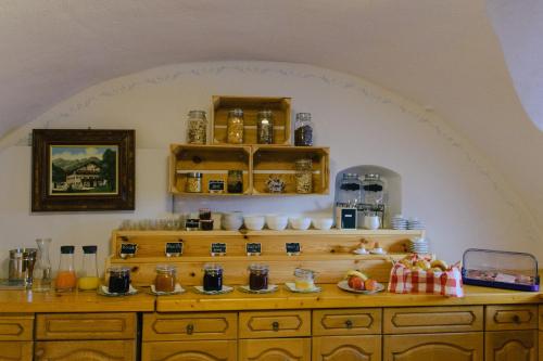 a kitchen with a wooden dresser in a room at Pension Lex in Bad Reichenhall