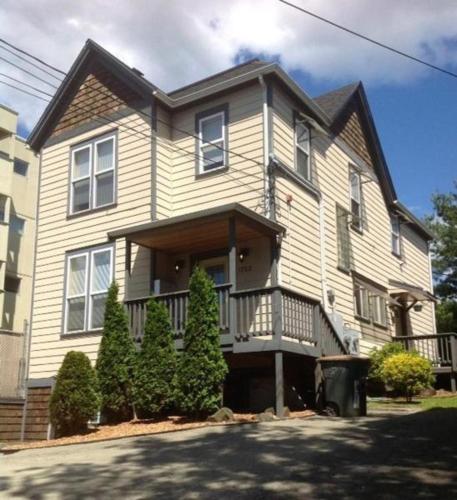 a large house with a porch and a balcony at Capitol Hill Luxury Apartments in Seattle