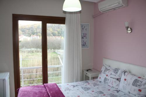 A bed or beds in a room at Sapphire Hotel