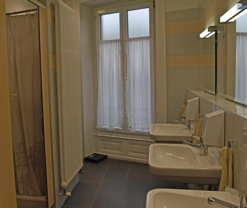 Ванная комната в Pension Bienvenue (Women only)