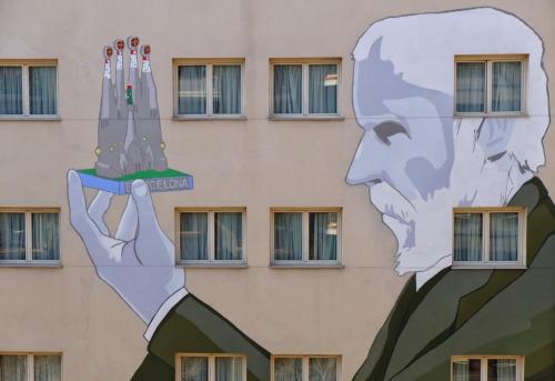 a mural of a head on the side of a building at Hotel Sagrada Familia in Barcelona