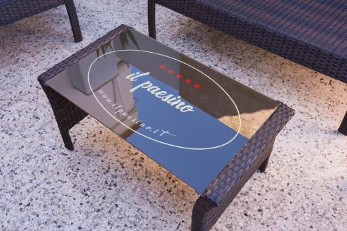 a coffee table with a sign on top of it at Experience Il Paesino in Licodia Eubea