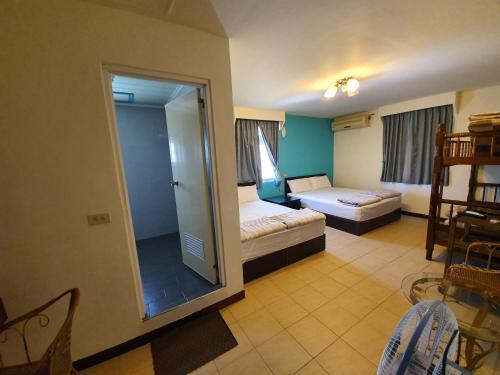 Postel nebo postele na pokoji v ubytování Ju Tong Homestay