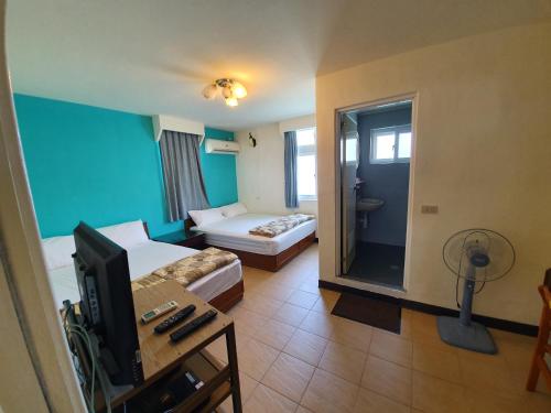 Postel nebo postele na pokoji v ubytování Ju Tong Homestay