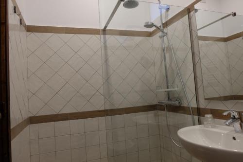 a bathroom with a shower and a sink at Hotel Villa Nettuno in Taormina