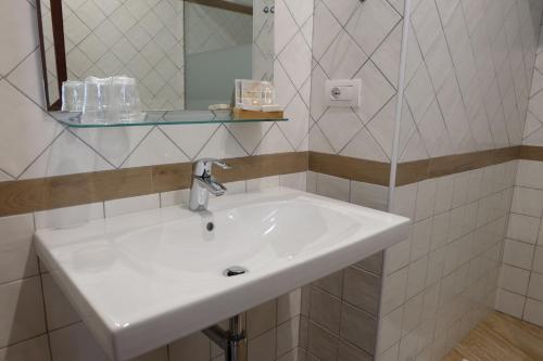 Ett badrum på Hotel Villa Nettuno