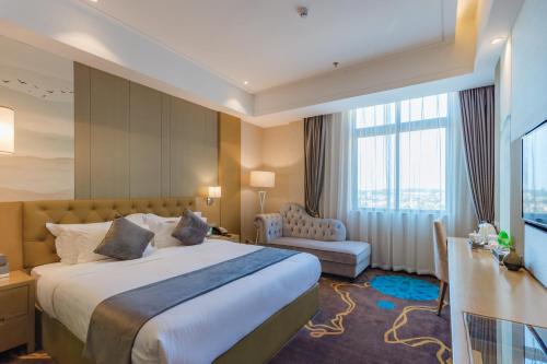 Ένα ή περισσότερα κρεβάτια σε δωμάτιο στο Taishan He Style Hotel