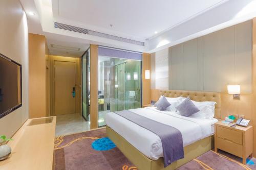Ένα ή περισσότερα κρεβάτια σε δωμάτιο στο Taishan He Style Hotel