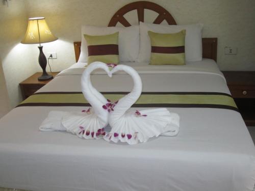 Cama o camas de una habitación en Natacha Hotel