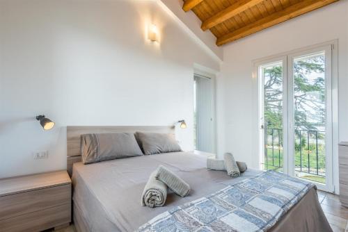 Posteľ alebo postele v izbe v ubytovaní Dimora Villa Ada