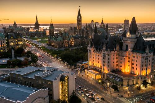 an aerial view of a city at sunset at Fairmont Chateau Laurier Gold Experience in Ottawa