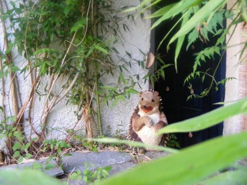 a teddy bear standing in front of a building at Kalamitsi Studios in Kalamitsi