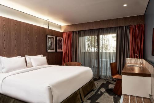 
מיטה או מיטות בחדר ב-AthensWas Design Hotel
