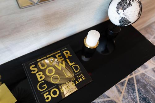 a black table with a book and a lamp at Legacy Hotel at IMG Academy in Bradenton