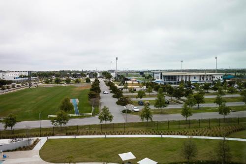 an aerial view of a park with trees and buildings at Legacy Hotel at IMG Academy in Bradenton