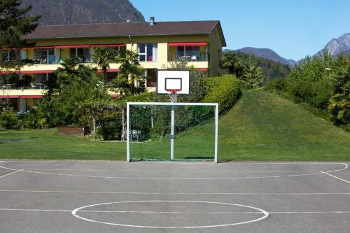 a basketball hoop in front of a house at Parkhotel Emmaus - Casa del Sole in Ascona