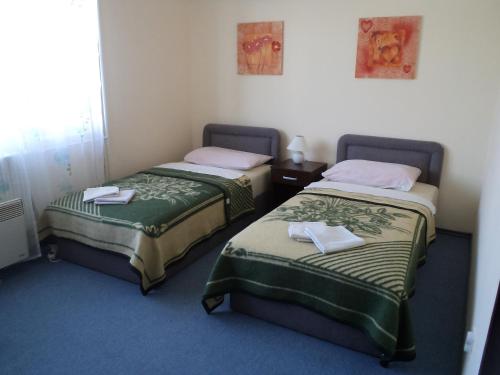 Кровать или кровати в номере Hotel Le Village