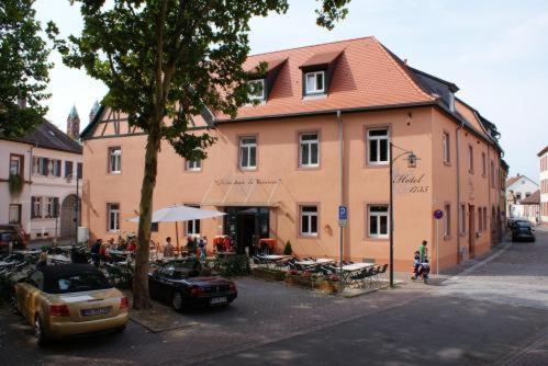 a building with a car parked in front of it at Hotel-Restaurant 1735 in Speyer
