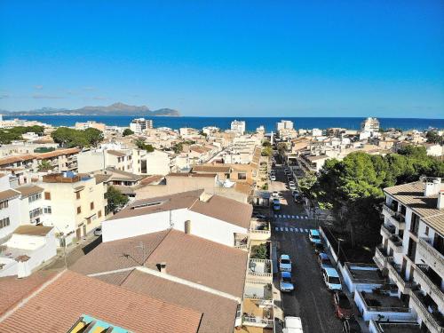 an aerial view of a city with buildings and the ocean at 146 Casa Starfish ETV6542 by Mallorca Charme in Can Picafort