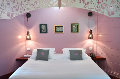 Ένα ή περισσότερα κρεβάτια σε δωμάτιο στο Tsilaosa Hôtel