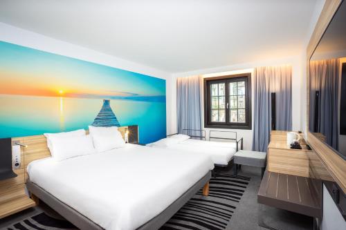 Postel nebo postele na pokoji v ubytování Hotel Novotel Brussels Off Grand Place