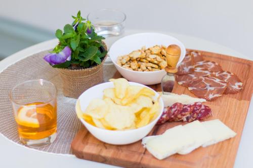 a tray of food with fruit and nuts on a table at Le Suite in Polistena