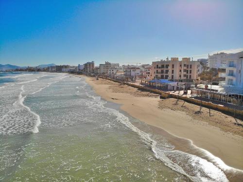 a view of a beach with buildings and the ocean at 146 Casa Starfish ETV6542 by Mallorca Charme in Can Picafort