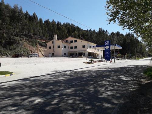 an empty street in front of a gas station at Nossa Senhora do Pranto in Ferreira do Zêzere