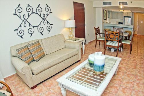 a living room with a couch and a table at Rincon Beach Resort in Rincon
