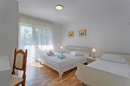 Postel nebo postele na pokoji v ubytování Ani in Trogir * Mittel-Dalmatien