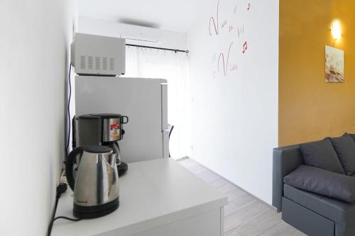 a kitchen with a coffee maker on a counter at Apartment Nicol in Zadar
