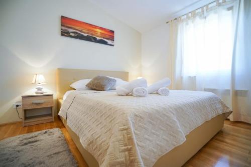 Posteľ alebo postele v izbe v ubytovaní Apartment Nicol