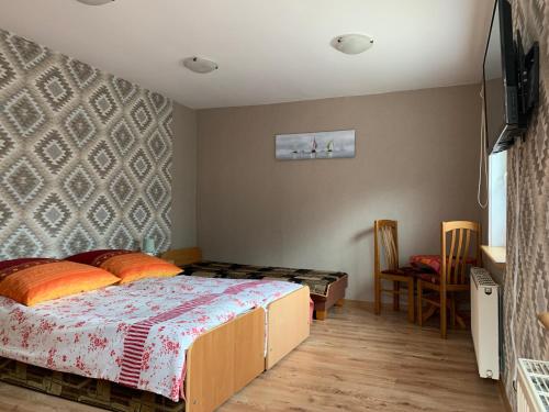 Una cama o camas en una habitación de Willa Justynka