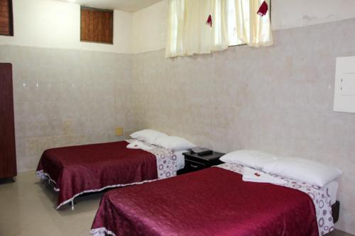 Cama o camas de una habitación en Hotel El Tesoro Del Llano