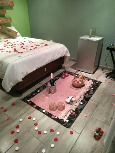 a room with a bed with a bunch of candies on the floor at Lapa la Bakgatlha in Soweto