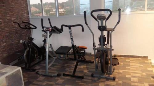 a group of exercise bikes in a gym at Hotel Girón Plaza in Girón