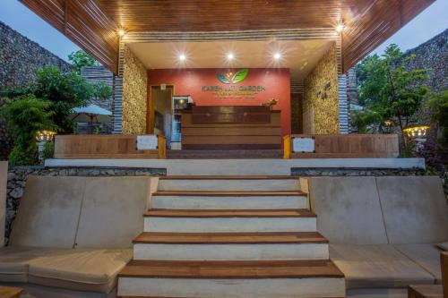 a building with stairs in front of a building at Kabeh Jati Garden Villa & Restaurant in Nusa Penida