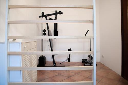 a room with white shelves with a microscope at La Corte in Alessandria