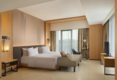 Ένα ή περισσότερα κρεβάτια σε δωμάτιο στο Hotel Santika Premiere Bandara Palembang