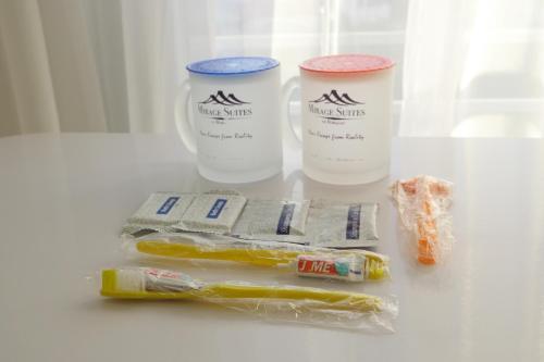 a table with two cups and a bag of food at Mirage Suites de Boracay in Boracay
