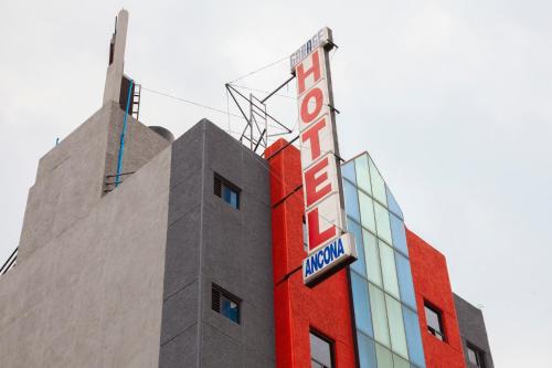 a building with a sign on the side of it at Hotel Ancona - S&oacute;lo Adultos in Mexico City