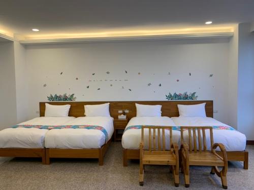 Una cama o camas en una habitación de 巨缿民宿巨象民宿