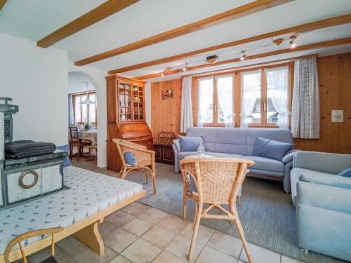 a living room with a couch and a table at Chalet Guttannen EG - GRIWA RENT AG in Guttannen