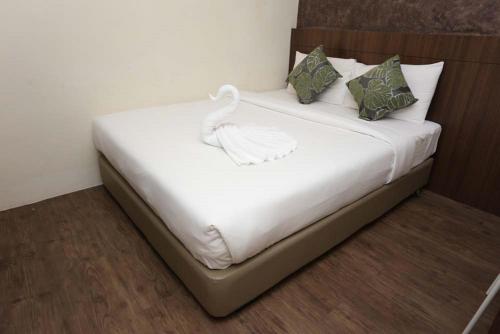 Postel nebo postele na pokoji v ubytování Hotel Westree KL Sentral