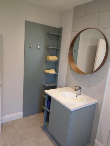 a bathroom with a sink and a mirror at Arbutus Lodge in Killarney