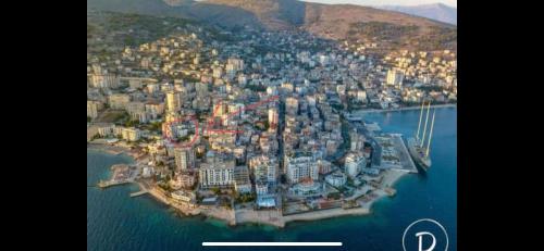 an aerial view of a city in the water at Villa Orkidea in Sarandë