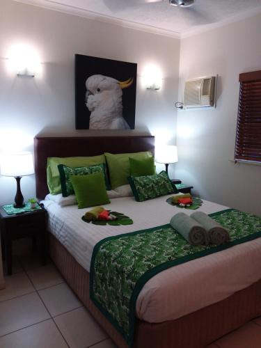 a bedroom with a bed with a stuffed animal on it at Jackies City Central Apartment in Cairns