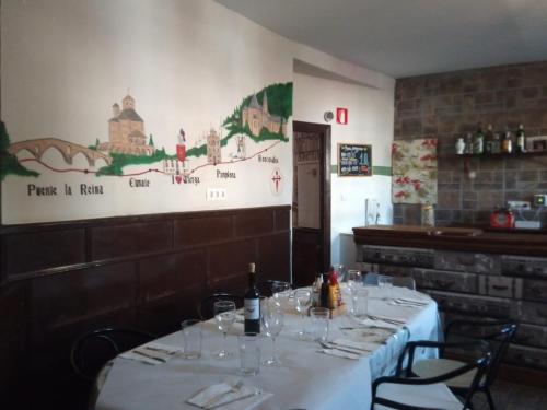 a dining room with a table in a restaurant at ALBERGUE CASA BAZTAN in Uterga